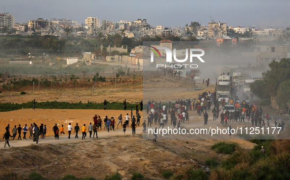 Palestinians are grabbing aid from a truck that is being delivered into Gaza through a U.S.-built pier, amid the ongoing conflict between Is...