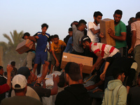 Palestinians are climbing onto trucks to grab aid that is being delivered into Gaza through a U.S.-built pier, amid the ongoing conflict bet...