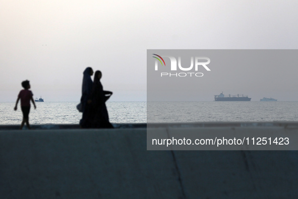 Ships are being pictured near a U.S.-built pier, as seen from central Gaza Strip, on May 18, 2024 