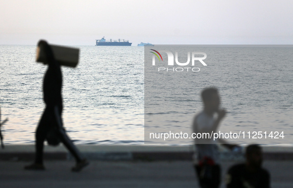 Ships are being pictured near a U.S.-built pier, as seen from central Gaza Strip, on May 18, 2024 