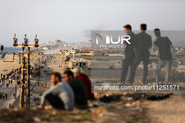 Smoke is billowing after Israeli bombardment in the central Gaza Strip on May 18, 2024, amid the ongoing conflict between Israel and the mil...