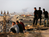 Smoke is billowing after Israeli bombardment in the central Gaza Strip on May 18, 2024, amid the ongoing conflict between Israel and the mil...