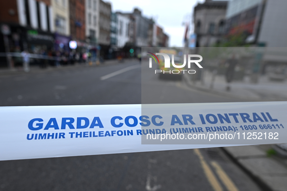 DUBLIN, IRELAND - MAY 18: 
A Garda Siochana tape reading 'Garda - No Entry' in Gaelic is closing the street in Dublin city center, on May 18...