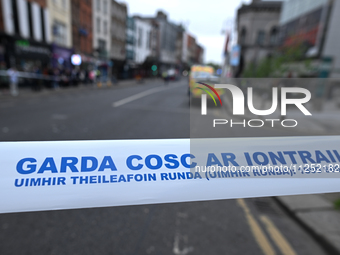 DUBLIN, IRELAND - MAY 18: 
A Garda Siochana tape reading 'Garda - No Entry' in Gaelic is closing the street in Dublin city center, on May 18...