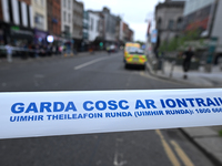 DUBLIN, IRELAND - MAY 18: 
A Garda Siochana tape reading 'Garda - No Entry' in Gaelic is closing the street in Dublin city center, on May 18...