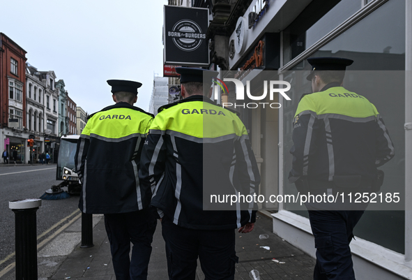 DUBLIN, IRELAND - MAY 18: 
Three members of the Garda Siochana (Irish Police) are patrolling in Dublin city center, on May 18, 2024, in Dubl...