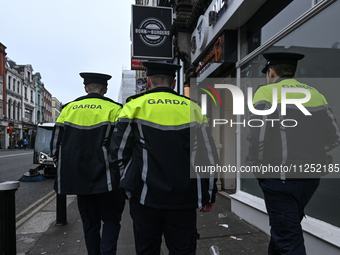 DUBLIN, IRELAND - MAY 18: 
Three members of the Garda Siochana (Irish Police) are patrolling in Dublin city center, on May 18, 2024, in Dubl...