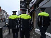 DUBLIN, IRELAND - MAY 18: 
Three members of the Garda Siochana (Irish Police) are patrolling in Dublin city center, on May 18, 2024, in Dubl...