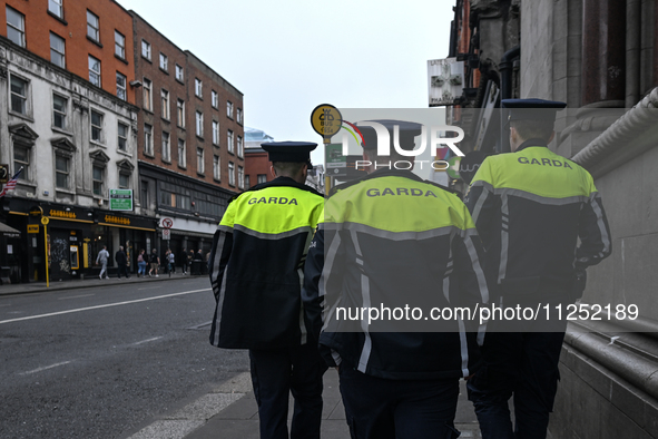 DUBLIN, IRELAND - MAY 18: 
Three members of the Garda Siochana (Irish Police) are patrolling in Dublin city center, on May 18, 2024, in Dubl...