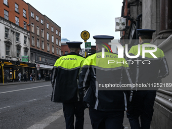 DUBLIN, IRELAND - MAY 18: 
Three members of the Garda Siochana (Irish Police) are patrolling in Dublin city center, on May 18, 2024, in Dubl...