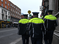 DUBLIN, IRELAND - MAY 18: 
Three members of the Garda Siochana (Irish Police) are patrolling in Dublin city center, on May 18, 2024, in Dubl...