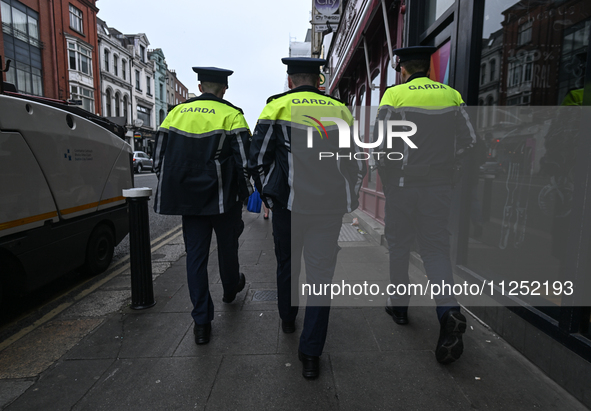 DUBLIN, IRELAND - MAY 18: 
Three members of the Garda Siochana (Irish Police) are patrolling in Dublin city center, on May 18, 2024, in Dubl...