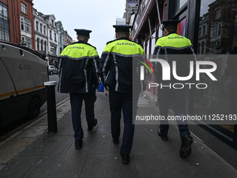 DUBLIN, IRELAND - MAY 18: 
Three members of the Garda Siochana (Irish Police) are patrolling in Dublin city center, on May 18, 2024, in Dubl...