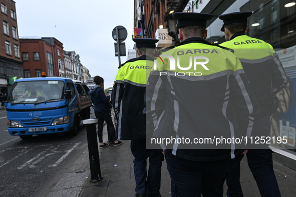 DUBLIN, IRELAND - MAY 18: 
Three members of the Garda Siochana (Irish Police) are patrolling in Dublin city center, on May 18, 2024, in Dubl...