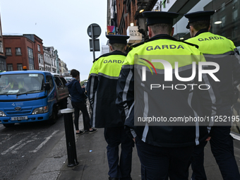 DUBLIN, IRELAND - MAY 18: 
Three members of the Garda Siochana (Irish Police) are patrolling in Dublin city center, on May 18, 2024, in Dubl...