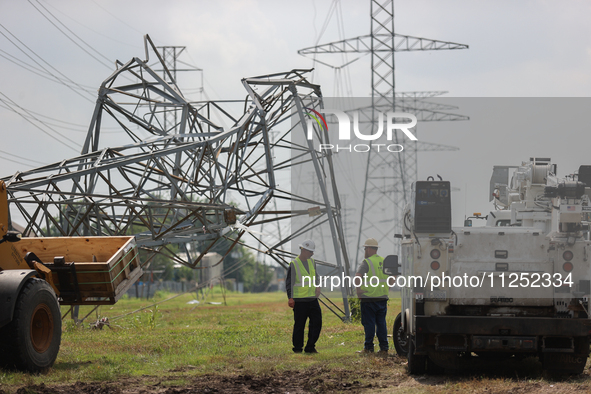 A mangled transmission tower is being seen at the intersection of Gardendale Dr. and Antoine Dr. as crews throughout Houston are working to...