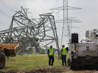 A mangled transmission tower is being seen at the intersection of Gardendale Dr. and Antoine Dr. as crews throughout Houston are working to...