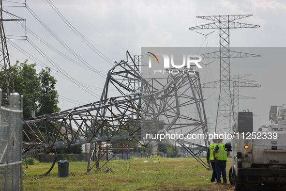 A mangled transmission tower is being seen at the intersection of Gardendale Dr. and Antoine Dr. as crews throughout Houston are working to...