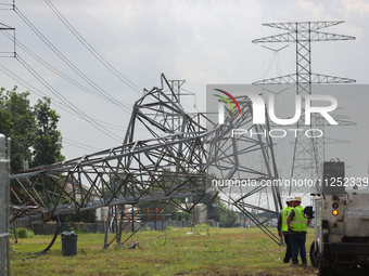 A mangled transmission tower is being seen at the intersection of Gardendale Dr. and Antoine Dr. as crews throughout Houston are working to...