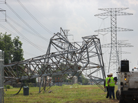 A mangled transmission tower is being seen at the intersection of Gardendale Dr. and Antoine Dr. as crews throughout Houston are working to...