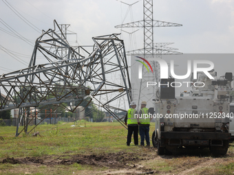 A mangled transmission tower is being seen at the intersection of Gardendale Dr. and Antoine Dr. as crews throughout Houston are working to...