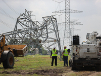 A mangled transmission tower is being seen at the intersection of Gardendale Dr. and Antoine Dr. as crews throughout Houston are working to...