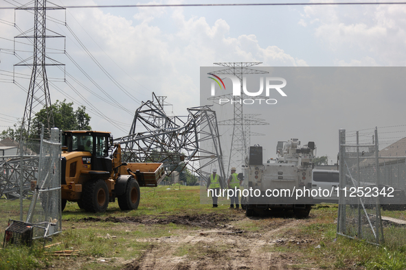 A mangled transmission tower is being seen at the intersection of Gardendale Dr. and Antoine Dr. as crews throughout Houston are working to...