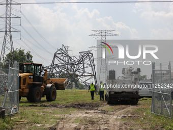 A mangled transmission tower is being seen at the intersection of Gardendale Dr. and Antoine Dr. as crews throughout Houston are working to...