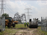 A mangled transmission tower is being seen at the intersection of Gardendale Dr. and Antoine Dr. as crews throughout Houston are working to...