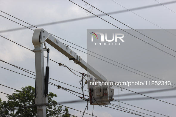 Electrical crews are working on power lines in the Spring Branch neighborhood of Houston, Texas. 