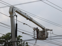 Electrical crews are working on power lines in the Spring Branch neighborhood of Houston, Texas. (