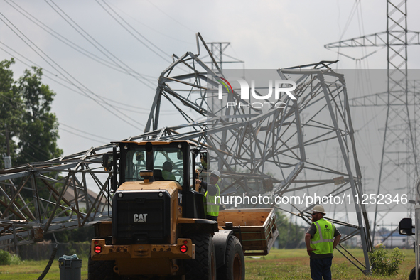 A mangled transmission tower is being seen at the intersection of Gardendale Dr. and Antoine Dr. as crews throughout Houston are working to...