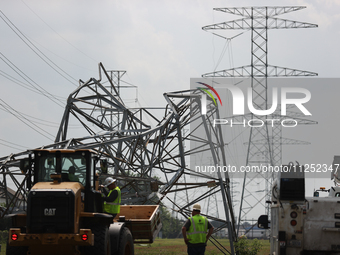 A mangled transmission tower is being seen at the intersection of Gardendale Dr. and Antoine Dr. as crews throughout Houston are working to...