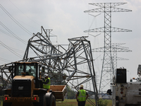 A mangled transmission tower is being seen at the intersection of Gardendale Dr. and Antoine Dr. as crews throughout Houston are working to...