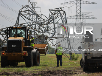 A mangled transmission tower is being seen at the intersection of Gardendale Dr. and Antoine Dr. as crews throughout Houston are working to...