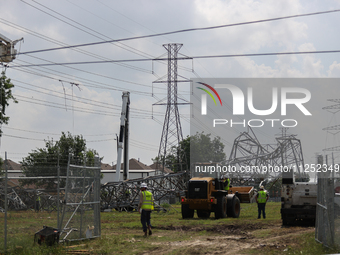 A mangled transmission tower is being seen at the intersection of Gardendale Dr. and Antoine Dr. as crews throughout Houston are working to...