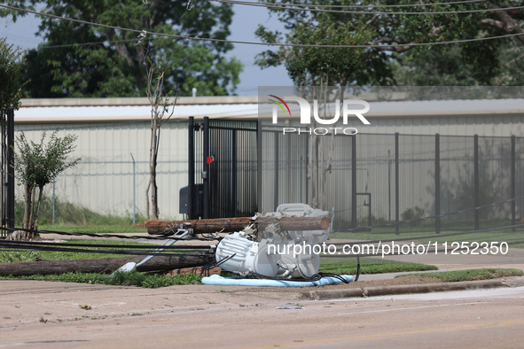 Power lines and electrical transformers are lying on the ground in the Spring Branch neighborhood in Houston, Texas. 