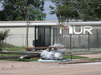 Power lines and electrical transformers are lying on the ground in the Spring Branch neighborhood in Houston, Texas. (