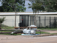 Power lines and electrical transformers are lying on the ground in the Spring Branch neighborhood in Houston, Texas. (