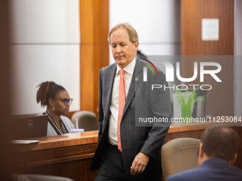 Texas Attorney General Ken Paxton is walking through the 185th Criminal District Court at Harris County Criminal Justice Center in Houston,...