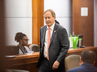 Texas Attorney General Ken Paxton is walking through the 185th Criminal District Court at Harris County Criminal Justice Center in Houston,...