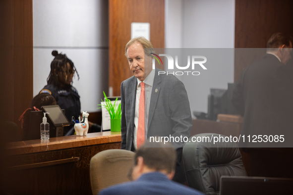 Texas Attorney General Ken Paxton is walking through the 185th Criminal District Court at Harris County Criminal Justice Center in Houston,...