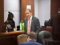 Texas Attorney General Ken Paxton is walking through the 185th Criminal District Court at Harris County Criminal Justice Center in Houston,...