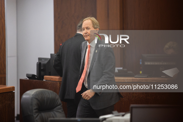 Texas Attorney General Ken Paxton is walking through the 185th Criminal District Court at Harris County Criminal Justice Center in Houston,...