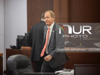 Texas Attorney General Ken Paxton is walking through the 185th Criminal District Court at Harris County Criminal Justice Center in Houston,...