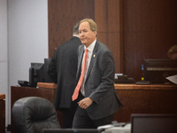 Texas Attorney General Ken Paxton is walking through the 185th Criminal District Court at Harris County Criminal Justice Center in Houston,...