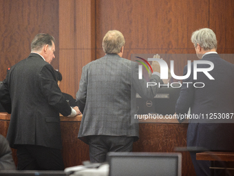 Texas Attorney General Ken Paxton is speaking to the judge alongside his attorneys in the 185th Criminal District Court at Harris County Cri...