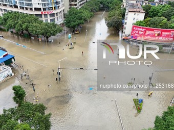 A flooded road is being seen after heavy rain in Nanning, Guangxi province, China, on May 19, 2024. (