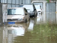 Vehicles are being stranded on a flooded road after heavy rains in Nanning, Guangxi province, China, on May 19, 2024. (