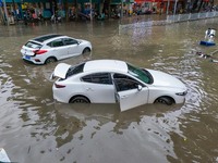 Vehicles are being stranded on a flooded road after heavy rains in Nanning, Guangxi province, China, on May 19, 2024. (